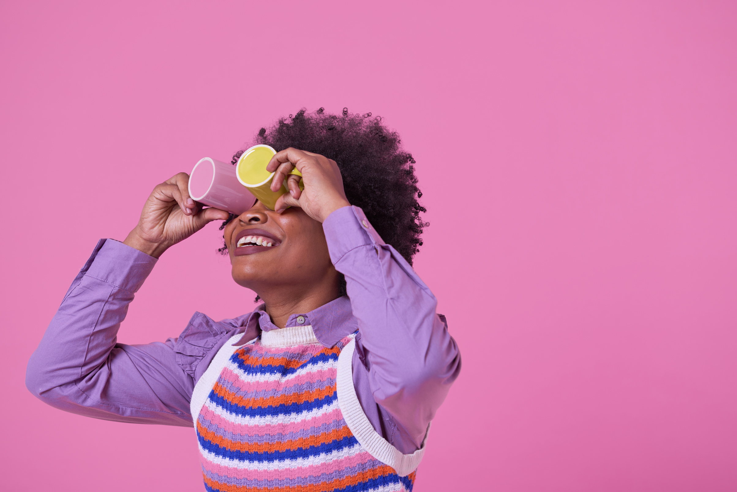 Bold & Punchy Silly Woman Holding Cups to Her Eyes